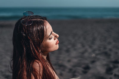 Woman looking at sea shore