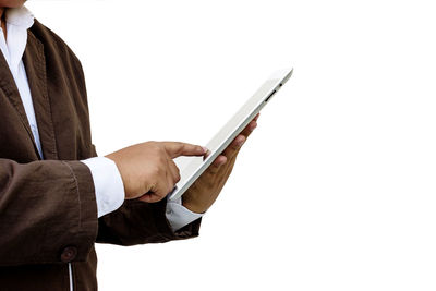 Man using mobile phone against white background