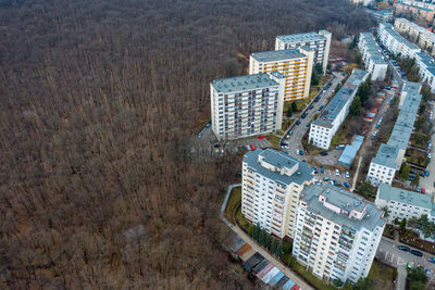 Aerial view of urban environment, city expansion against nature. expanding flat of blocks 