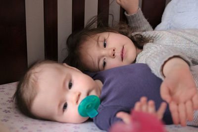 Close-up of cute siblings at home