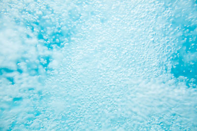 Full frame shot of water drops on swimming pool