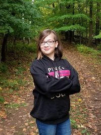 Portrait of teenage girl standing on land