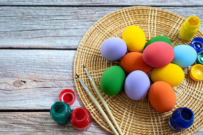 High angle view of multi colored candies in basket on table