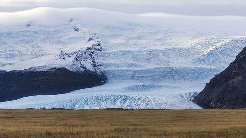 Scenic view of sea and mountain range