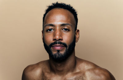 Close-up of young man against white background