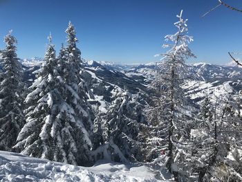 Scenic view of snowcapped mountains against clear sky