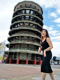 Full length of woman standing against the sky