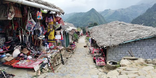 Panoramic view of houses and mountains against sky