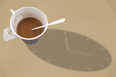 High angle view of coffee cup on table