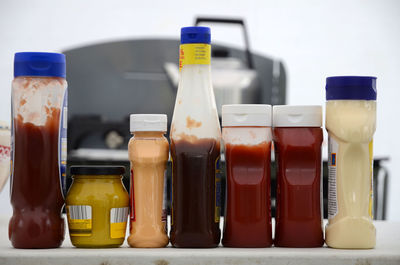 Close-up of yellow bottles on table