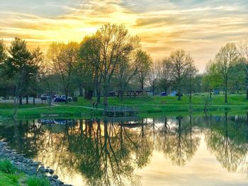Scenic view of lake against sky during sunset
