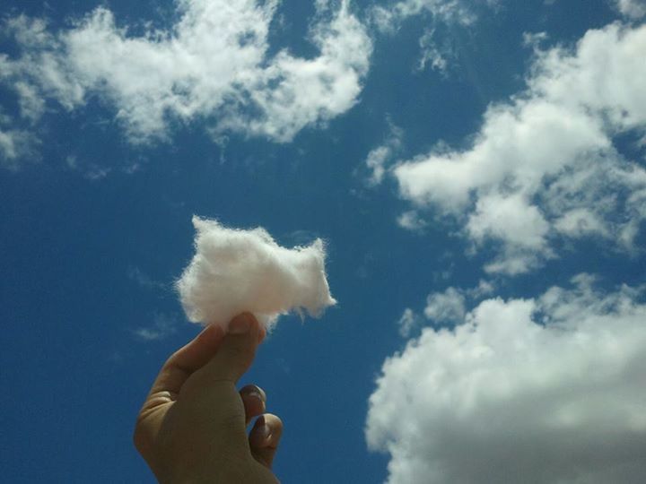 sky, low angle view, cloud - sky, person, cloud, holding, part of, blue, cloudy, white color, human finger, cropped, nature, leisure activity, day, lifestyles, outdoors