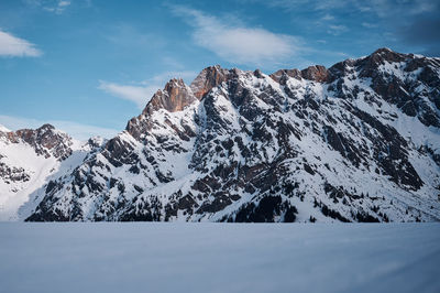 Scenic view of snowcapped mountains against sky