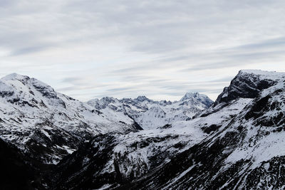 Scenic view of snowcapped mountains against sky