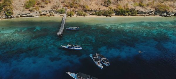 High angle view of sailboats in sea