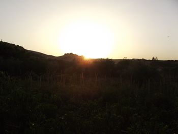 Scenic view of silhouette landscape against sky during sunset