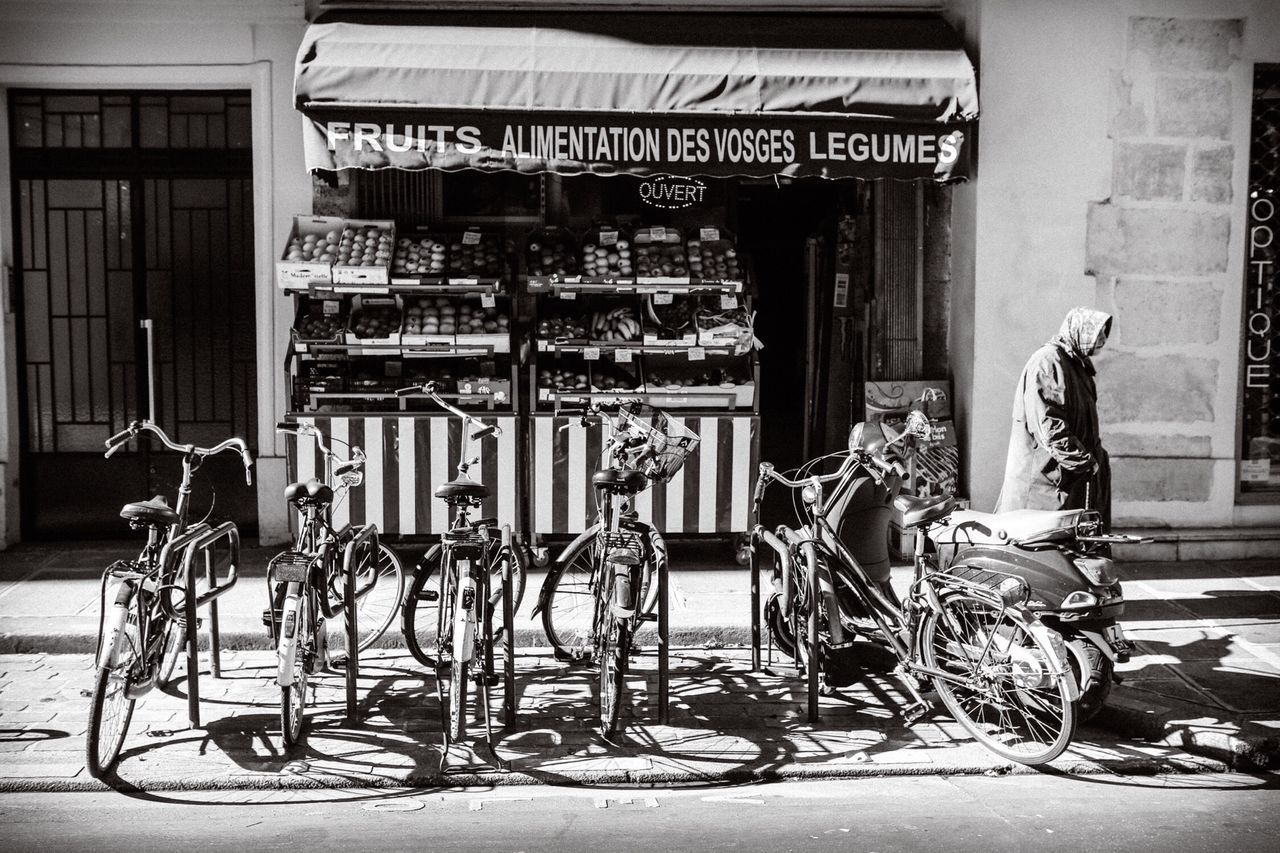 architecture, built structure, building exterior, bicycle, house, potted plant, stationary, parked, parking, store, transportation, window, wall - building feature, day, land vehicle, absence, mode of transport, wall, chair, no people