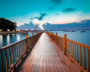 Pier over sea against sky