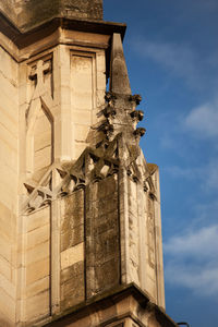 Low angle view of statue against historic building