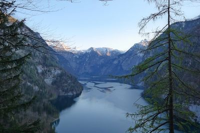 Scenic view of lake and mountains against sky