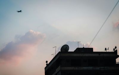 Low angle view of airplane flying in sky