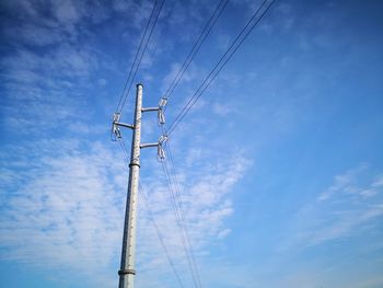 Low angle view of cables against sky