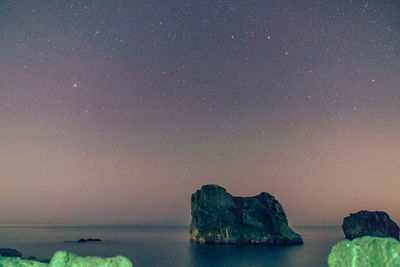 Scenic view of sea against sky at night