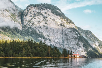 Scenic view of lake and mountains against sky