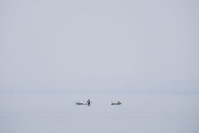 Low angle view of sea against clear sky