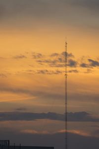 Low angle view of silhouette tower against sky during sunset