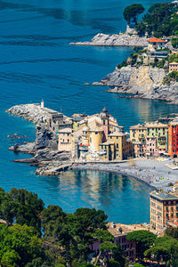 High angle view of townscape by sea