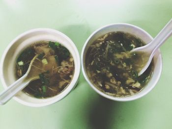 Directly above view of soup served in bowls on table