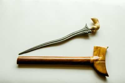 High angle view of fork on table against white background