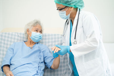 Female doctor examining chemical at clinic