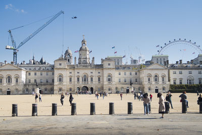 Group of people in front of buildings