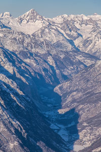 Close-up of snow on mountain against sky