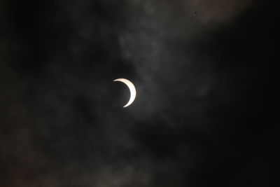 Low angle view of moon against sky at night