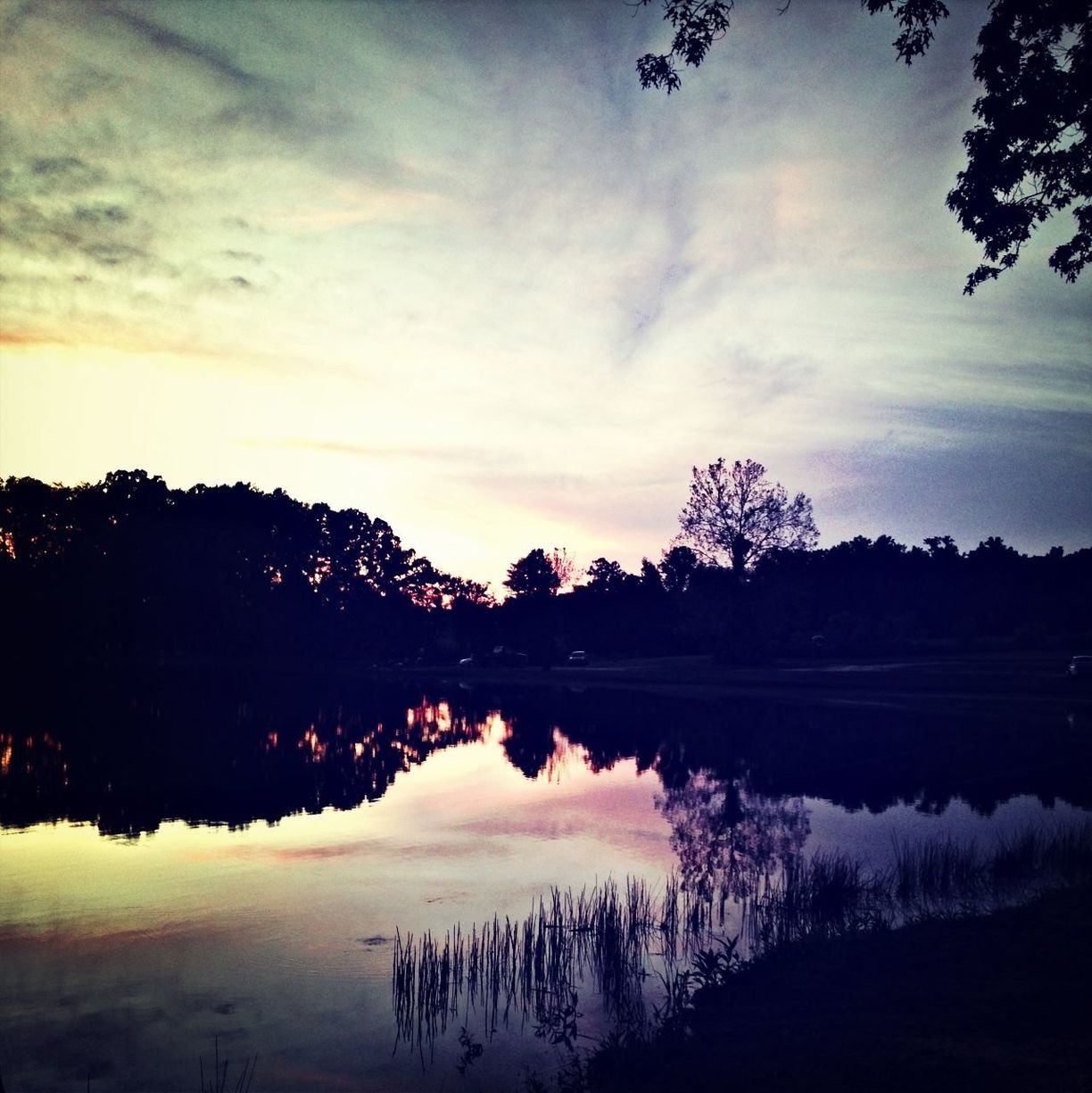 reflection, water, lake, tranquil scene, silhouette, tranquility, tree, sky, scenics, sunset, beauty in nature, cloud - sky, nature, calm, standing water, idyllic, dusk, cloud, waterfront, river