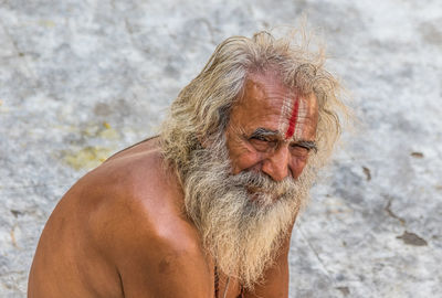 Mid adult man looking away outdoors