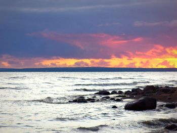 Scenic view of sea against dramatic sky