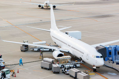 High angle view of airplane of airport runway