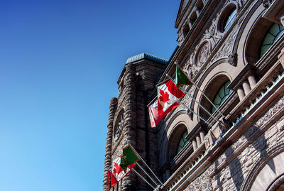 Low angle view of building against blue sky