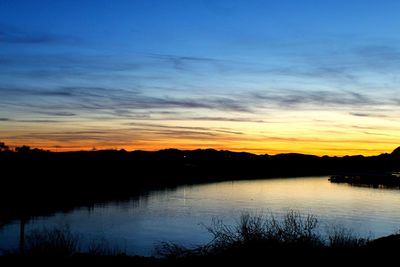 Scenic view of lake during sunset