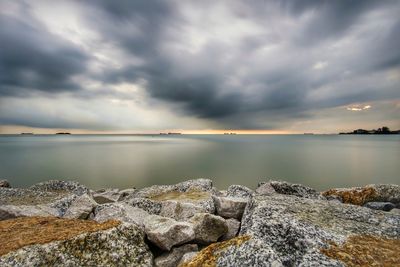 Scenic view of sea against cloudy sky