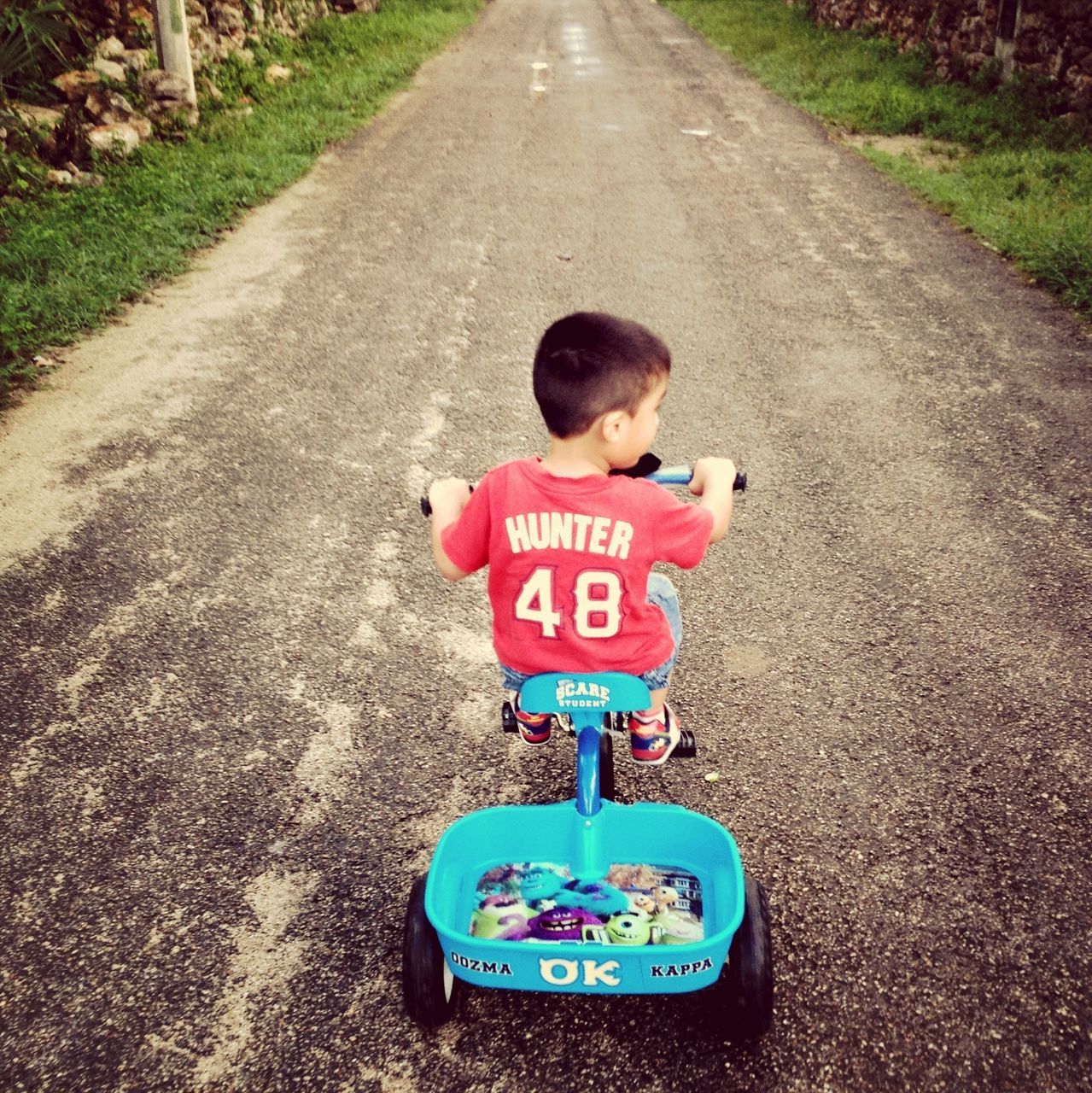 childhood, communication, text, road, high angle view, western script, the way forward, street, transportation, elementary age, guidance, day, road sign, full length, sign, boys, outdoors, front view