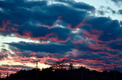 Low angle view of dramatic sky during sunset