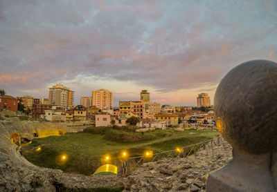 High angle view of illuminated buildings against sky during sunset