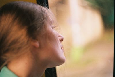 Close-up portrait of a girl looking away