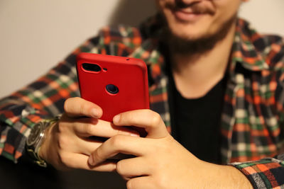 Midsection of woman using mobile phone