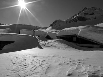 Scenic view of snowcapped mountains against sky during winter